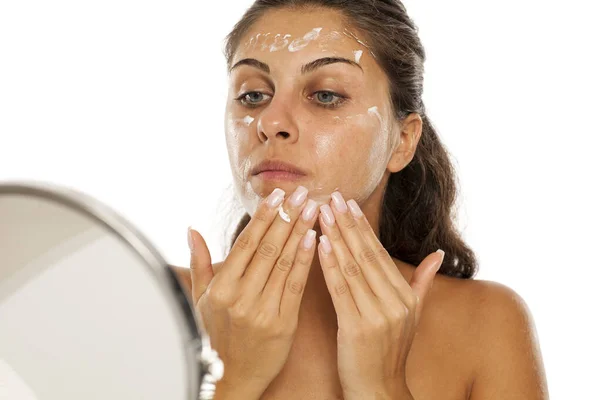 Young Woman Applying Cream Her Face — Stock Photo, Image