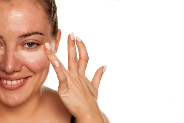 Young Woman Applying Concealer Her Eyes Brush White Background — Stock Photo, Image