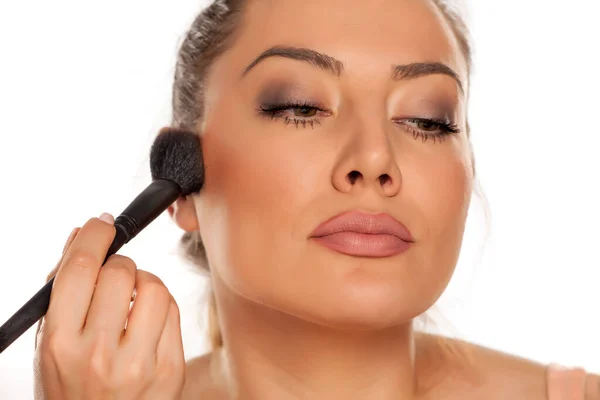 Young Woman Applying Blush Brush White Background — Stock Photo, Image