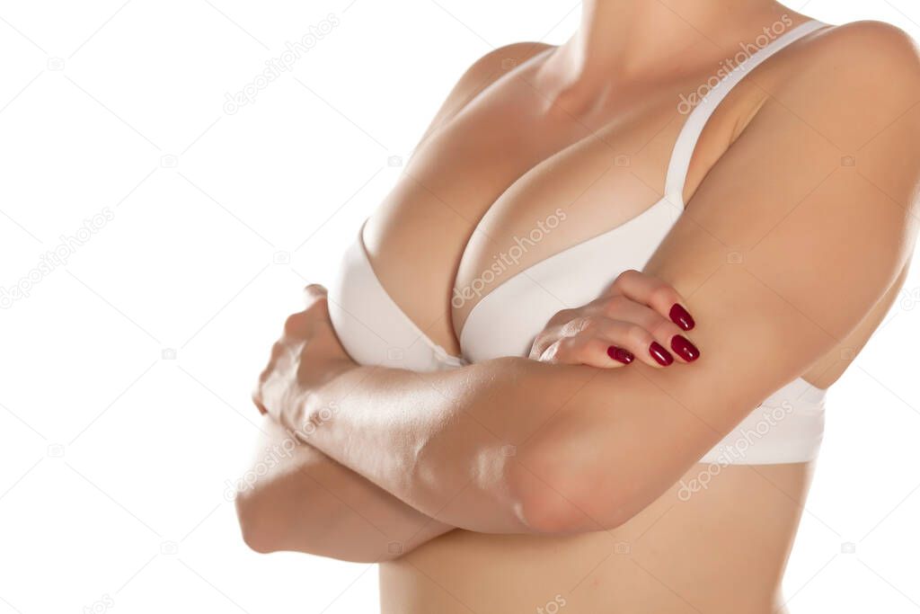 woman with white bra with crossed hands