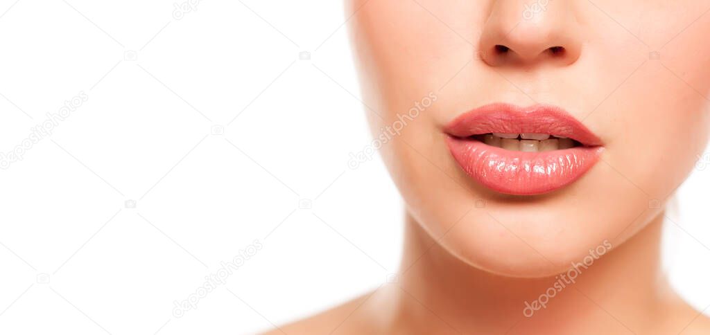 beautiful female lips with lip gloss on white background