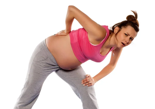 Těhotná Žena Dělá Cvičení Bílém Pozadí — Stock fotografie