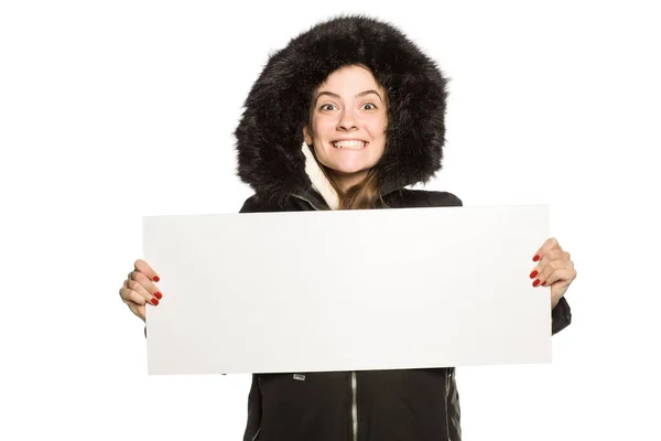 Young Model Winter Jacket Hood Shows Empty Advertising Board White — Stock Photo, Image