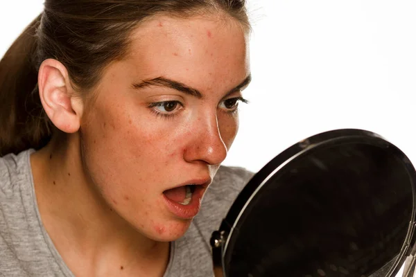 Young Concerned Woman Makeup Looking Her Self Mirror White Background — Stock Photo, Image