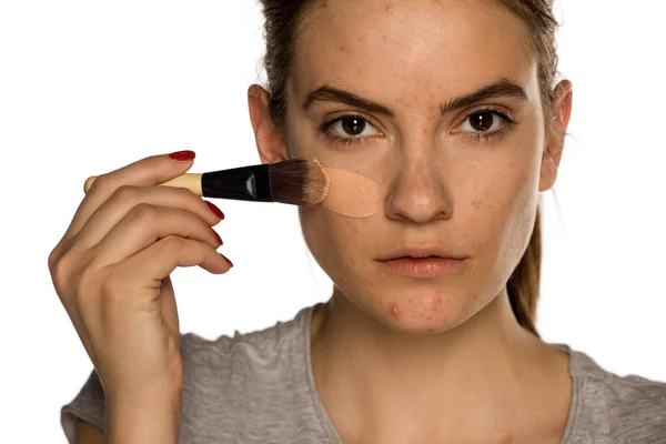 Young Freckled Woman Applying Liquid Foundation White Background — Stock Photo, Image