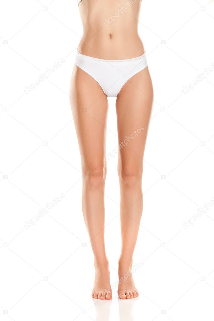 beautifully cared feminine legs and white panties