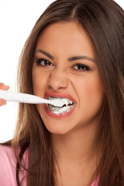 Young Woman Brushing Her Teeth Electric Tooth Brush White Background — Stock Photo, Image