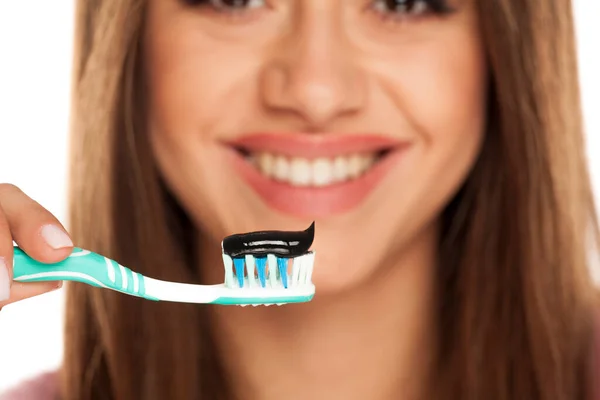 Young Woman Holding Tooth Brush Black Active Charcoal Toothpaste White — Stock Photo, Image