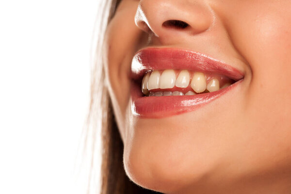 Smiling woman with natural and healthy teeth