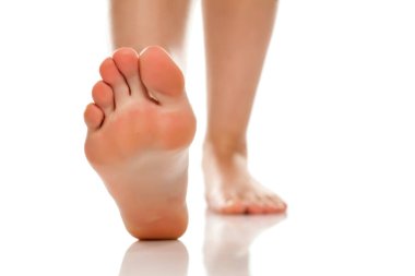 female bare feet on white background clipart