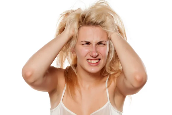 Crazy Woman Pulling Her Messy Hair Stock Photo