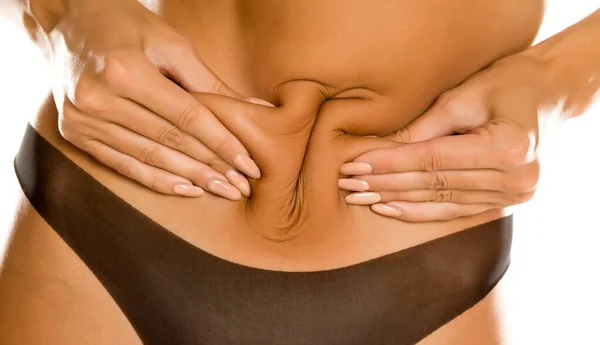 Young Woman Pinching Her Belly White Background — Stock Photo, Image