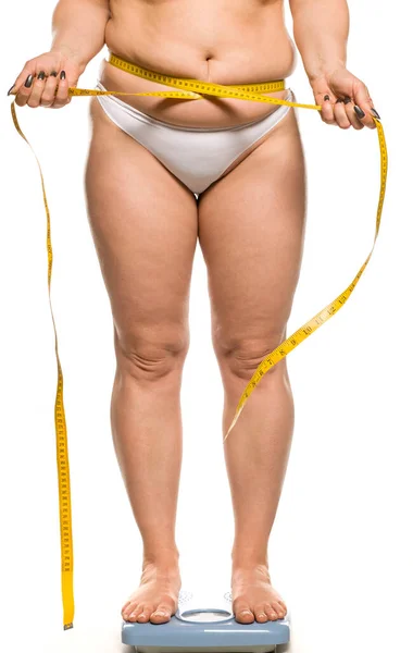 Fat Woman Stands Scales Measure Her Waist White Background — Stock Photo, Image