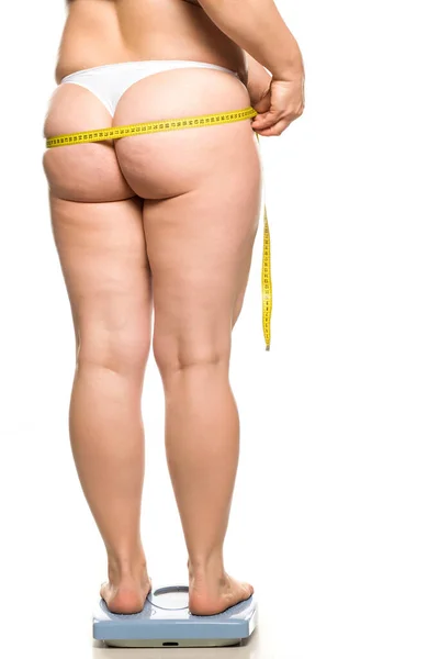 Fat Woman Stands Scales Holds Measure Her Buttocks White Background — Stock Photo, Image