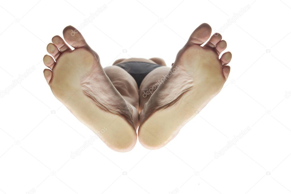 feminine feet from below with the load points