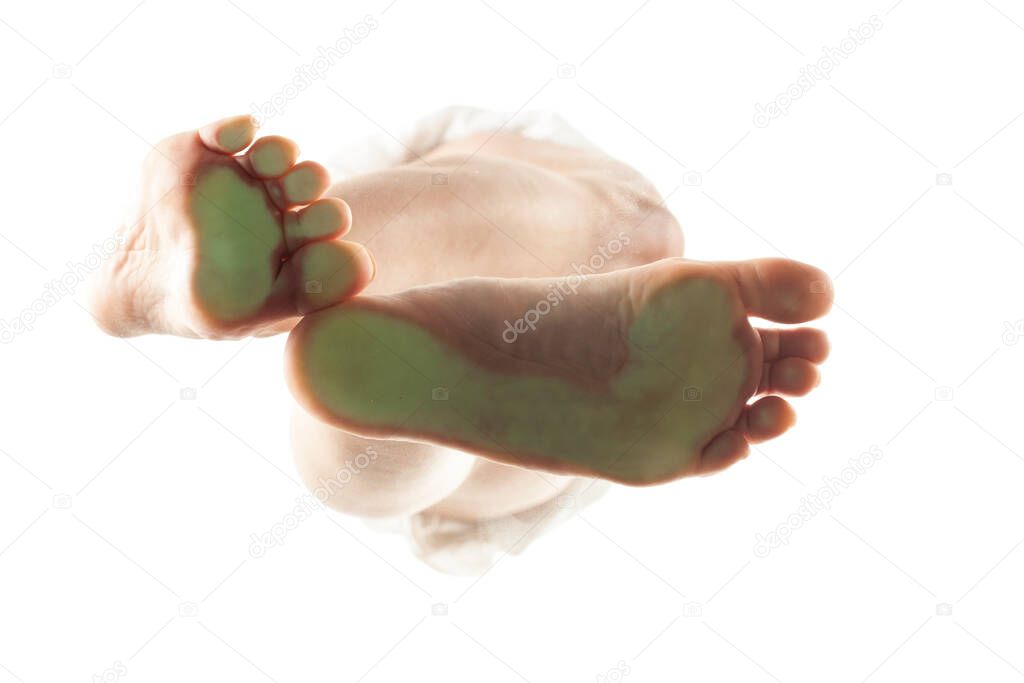 feminine feet from below with the load points