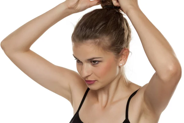 Profile Young Woman Tightening Her Hair Bun White Background — Stock Photo, Image