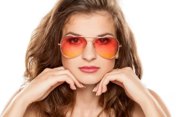 stock image Portrait of young beautiful woman with long curly hair and sunglasses on white background