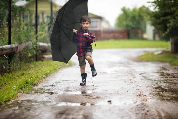 Small Boy Wearing Rubber Boots Walking Black Umbrella Rain — Stock Photo, Image