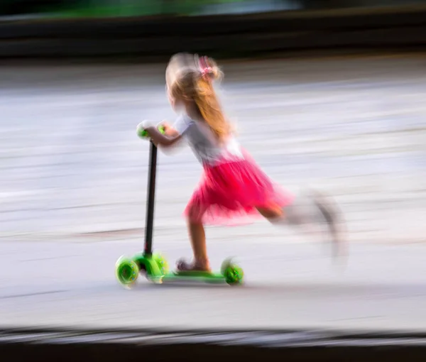 Little Girl Riding Scooter Outdoors Street Urban Background Intentional Motion — Stock Photo, Image