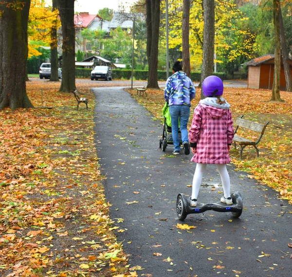 Girl Helmet Riding Hoverboard Park Autumn Day — Stock Photo, Image