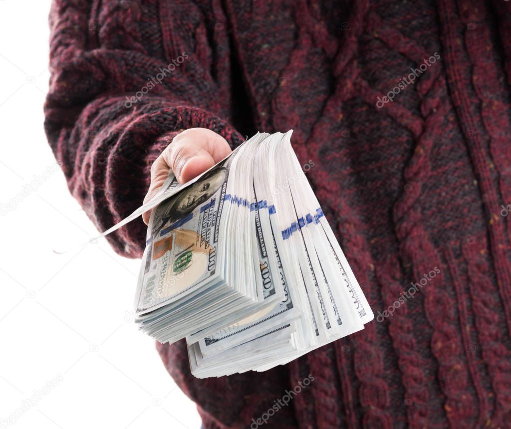 Man holding pack of dollar bills