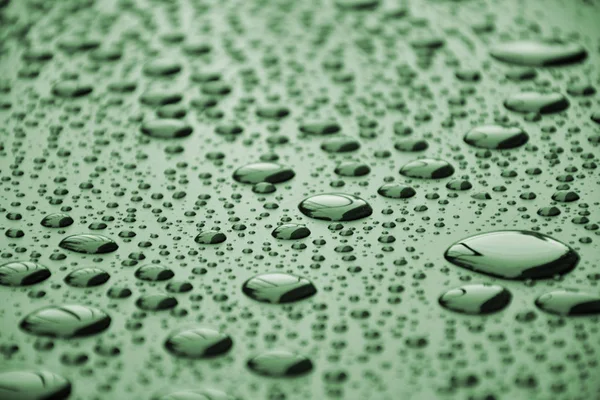 Närbild vatten droppar på metallyta kan användas för webbdesign — Stockfoto