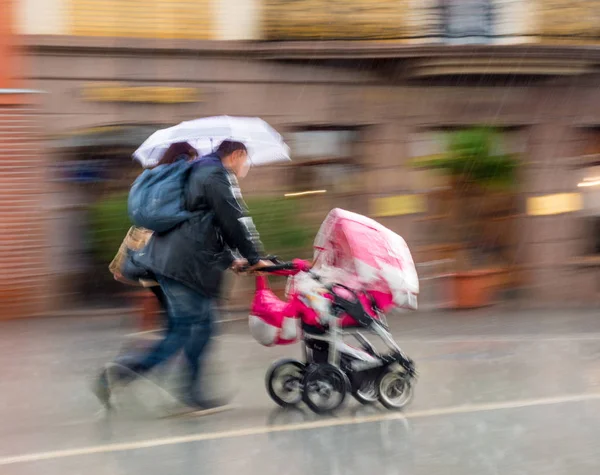 People with umbrella walking down the street on rainy day