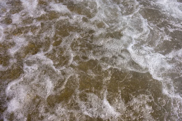 Close up sea water waves with bubbles — Stock Photo, Image