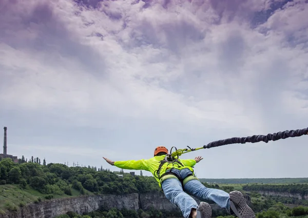 Rope jumping. Man jumping from the bridge