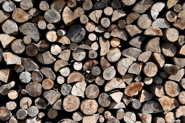 Pile of wood logs ready for winter. Wood logs texture background