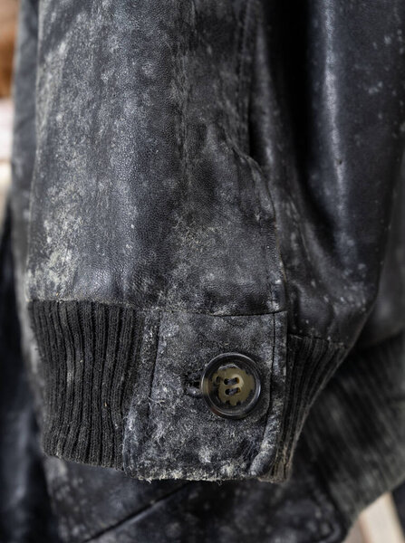 Damaged leather black jacket by mold