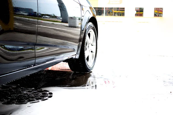 Car washing banner copy space. Cleaning car using high pressure water. Contactless self-service car wash. Concept disinfection and antiseptic cleaning of the vehicle. Russia, Rostov-on-Don 06.12.2020