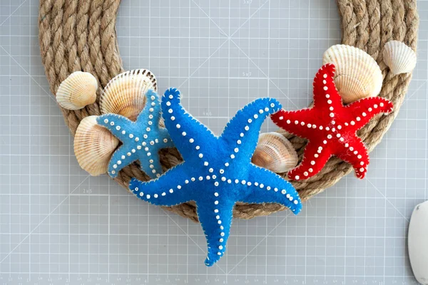 DIY instruction. Step by step tutorial. Making Summer decor - wreath of rope with sea stars made of felt. Craft tools and supplies. Step 7 - Final.