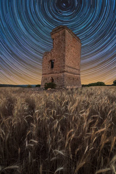 Star trail over an old castle