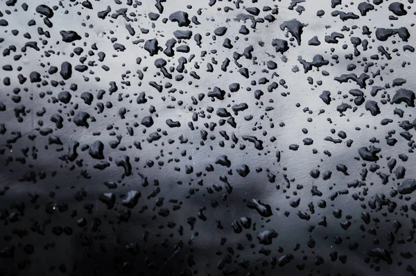 Zwarte regendruppels olieverf op oppervlakte achtergrondstructuur — Stockfoto