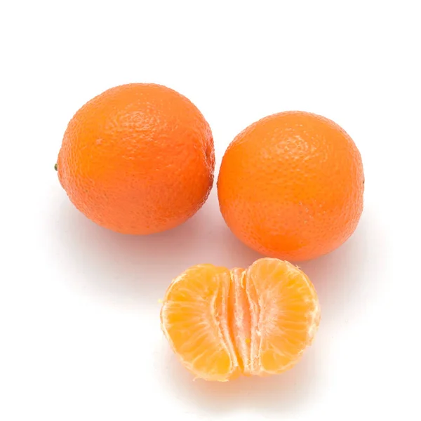 Two Mandarin and one half isolated on white background. — Stock Photo, Image
