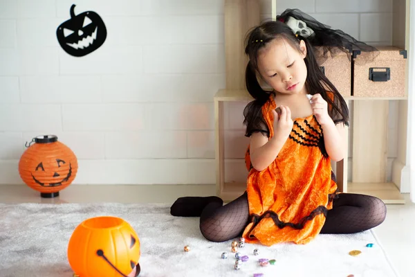 Portrait Asian Little Girl Throwing Eating Candy Chocolate Trick Treat — Stock Photo, Image