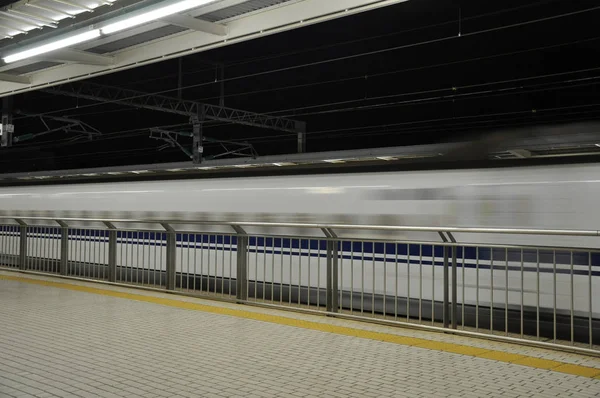 Blurred motion picture of high speed train moving pass the station