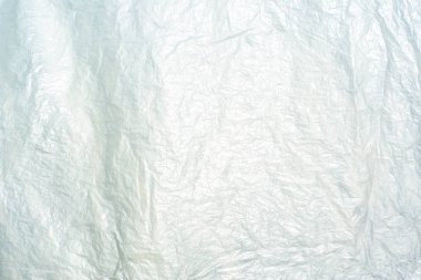 Soyut doku ve buruşuk plastik tabaka reflec güneş ışığı için arka plan
