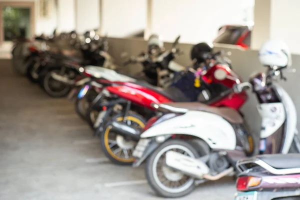 Defocused picture of motorcycles parking at the parking lots. Blurred vehicles at the parking lots in purpose