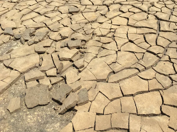 Top view closeup weathered texture and background of arid cracked ground. — ストック写真