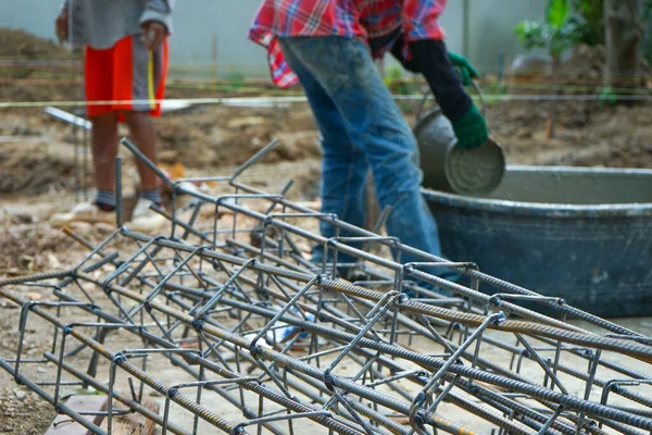 Closeup Pile Reinforcement Steelwork Ground Construction Site Blurred Workers Carrying — Stock Photo, Image