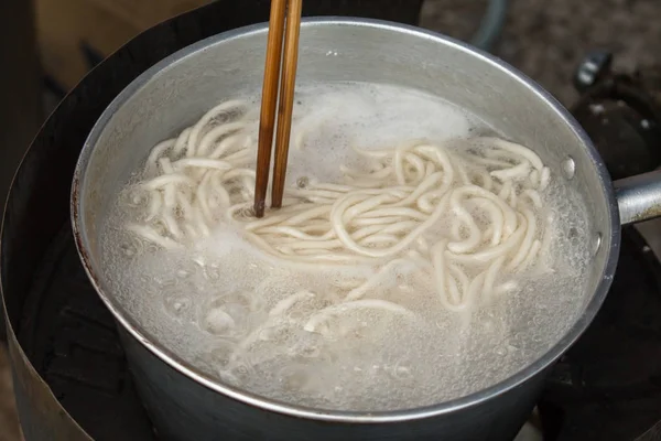Close up of Cooking Vietnamese noodle with soup containing rice vermicelli.Street food.