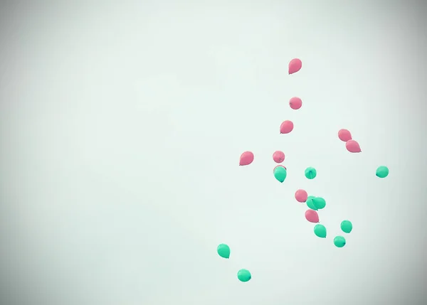 Flying Balloons in gray cloudy sky background, Poor lighting day — Stock Photo, Image