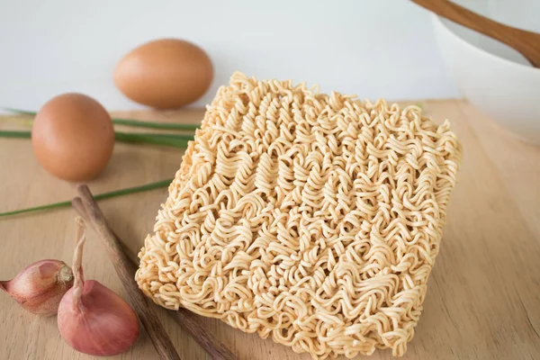 Dried Instant noodle on the wood table.