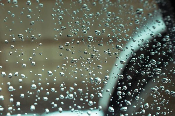 Gotas de agua en el fondo de cristal ventana. —  Fotos de Stock