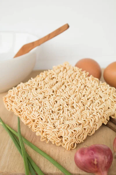 Dried Instant noodle on the wood table.