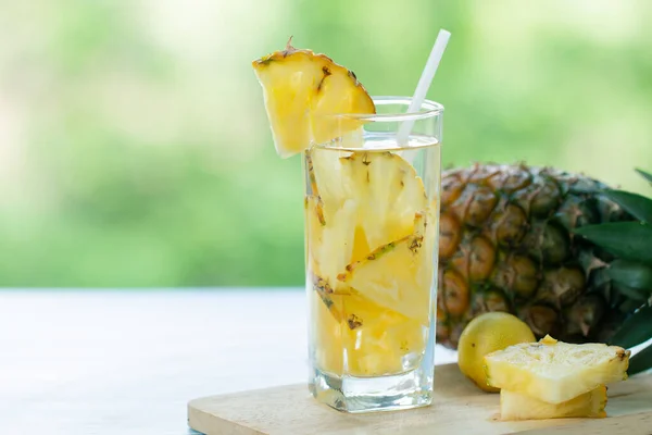 Pineapple Juice Pieces Pineapple Healthy Drink and summer fruit drink Concept.