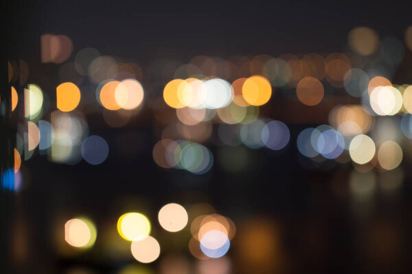Defocused city night light blurred with bokeh abstract background